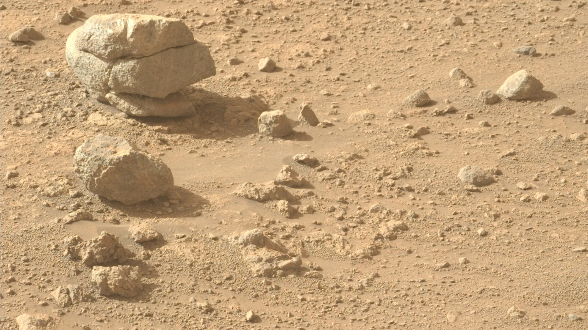Perseverance rover arm near layered Bright Angel rocks in Jezero Crater