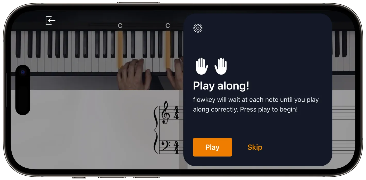 Flowkey lesson on a smartphone with a video performance above synchronized interactive sheet music