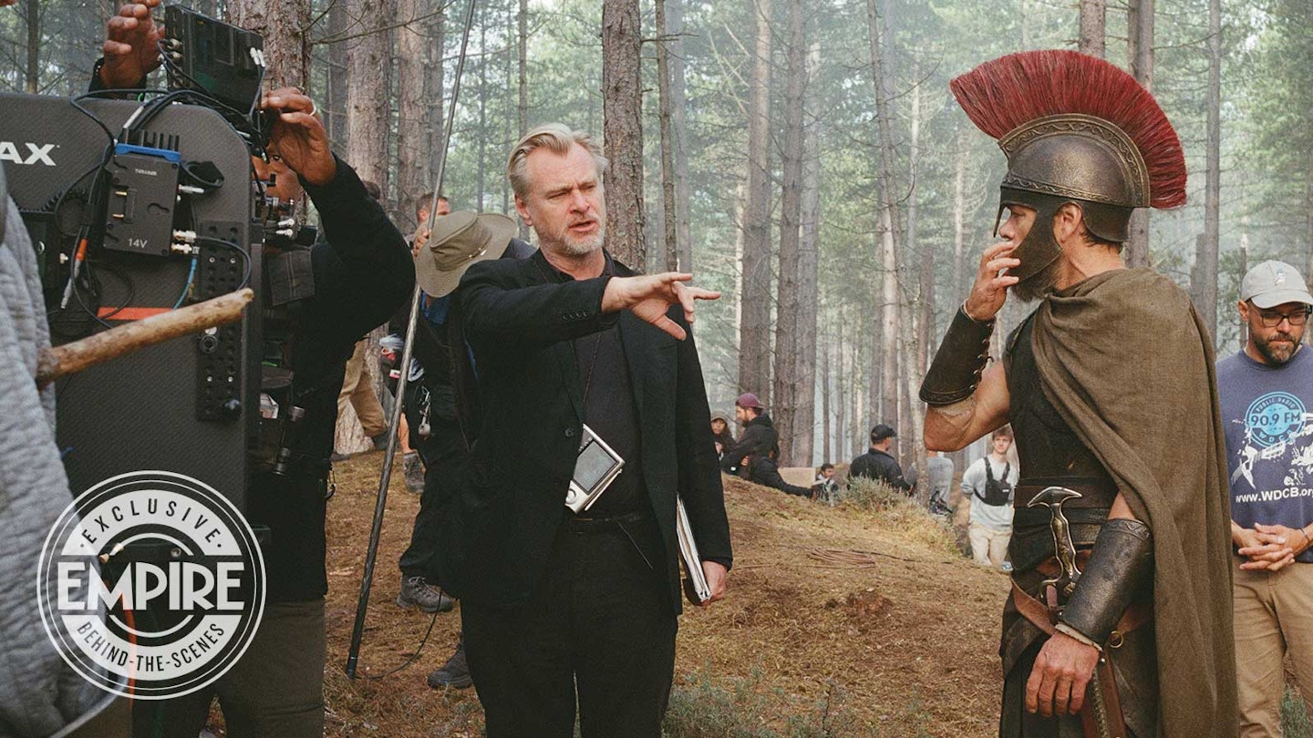 Behind-the-scenes view of armored Laestrygonian giants fighting Odysseus' soldiers in a forest