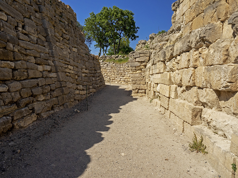 Stone fortification walls at Troy VI showing tilted and misaligned masonry associated with seismic damage