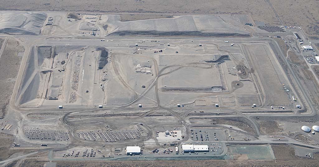 Aerial view of Hanford Trench 94 with rows of sealed naval reactor compartment packages in an engineered disposal trench